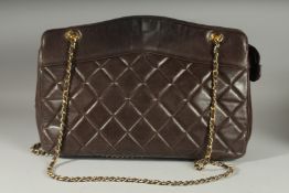 A GOOD CHANEL BROWN PADDED LEATHER BAG AND WALLET. Serial no. 1369616, with long gilt and leather