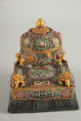 A TIBETAN FILIGREE DZI BEAD INSET PRAYER DECORATION,containing a scroll. 15.5cms long.