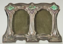 A SMALL SILVER DOUBLE PHOTOGRAPH FRAME. 3ins x 4.5ins.