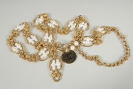 A VERY GOOD CHANEL GILT AND PEARL NECKLACE with twelve sections with six pearls. 36ins long.