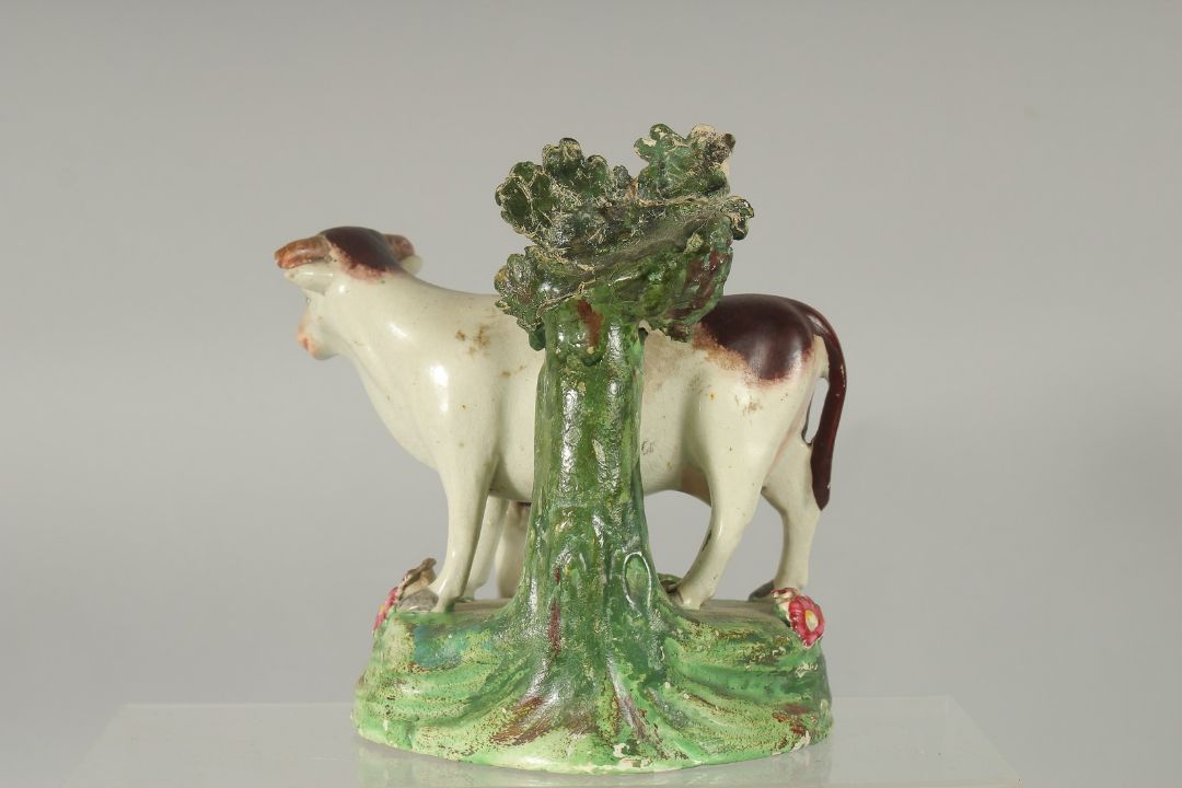 A STAFFORDSHIRE BOCAGE GROUP OF A COW AND CALF 5.5ins high. - Image 2 of 3