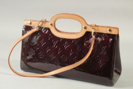 A GOOD LOUIS VUITTON BROWN/ MAROON PATENT LEATHER MONOGRAM HAND BAG. 12.5ins long