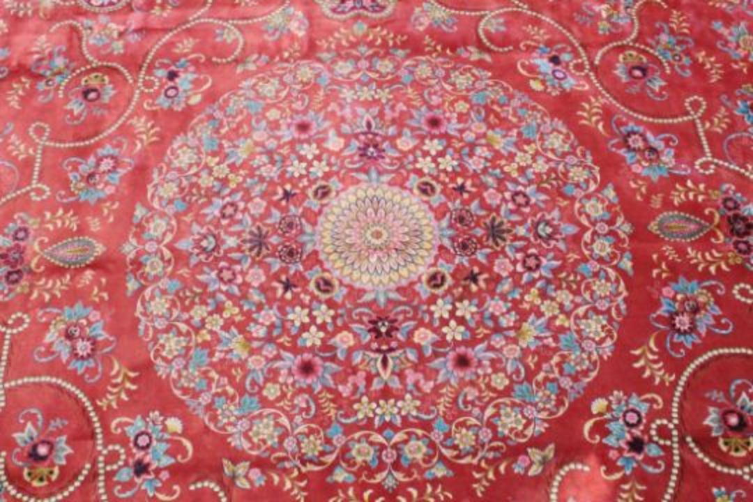 A VERY GOOD ISLAMIC CARPET, 20TH CENTURY, salmon pink with a rich blue border, having an allover - Image 2 of 3