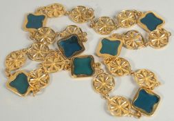 AN ALAMBRA GILT AND BLUE ENAMEL NECKLACE. 22ins long.