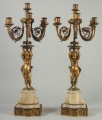 A GOOD PAIR OF 19TH CENTURY ORMOLU AND ONYX FIVE BRANCH, SIX LIGHT CANDELABRAS, the ornate scrolling