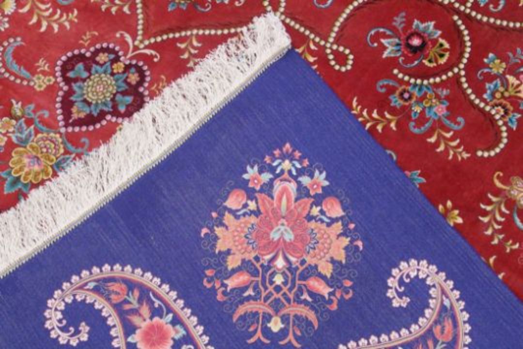 A VERY GOOD ISLAMIC CARPET, 20TH CENTURY, salmon pink with a rich blue border, having an allover - Image 3 of 3