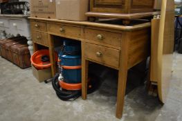 A pine side table with five small drawers.