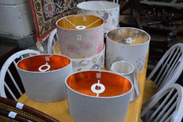 A quantity of decorative lamp shades.
