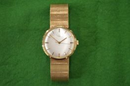 A Longines gentlemans 9ct gold wrist watch with 9ct gold mesh bracelet strap.