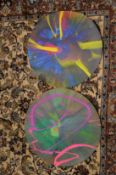 After Damien Hirst, a pair of circular spin pictures, both unframed.