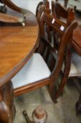 A set of four mahogany dining chairs.