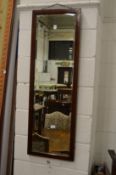 A mahogany dressing mirror.