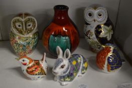 A small collection of Royal Doulton animals and birds together with a Poole pottery vase.