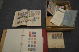 A box of stamps and stamp albums.