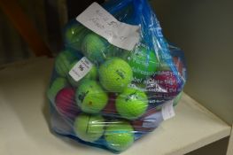 A bag of fifty mixed coloured golf balls.