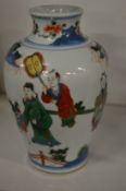 A Chinese pottery vase decorated with figures.