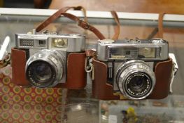A Voigtlander Vitomatic IIa together with a Vitomatic IIb, both with cases.