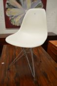 A Vitra Eames DAR side chair.