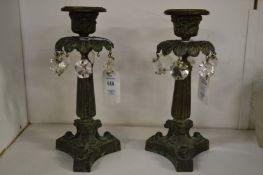 A pair of 19th century classical bronze candle lustres.