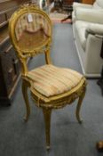 A gilt wood occasional chair.