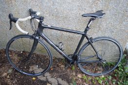 A Planet X carbon fibre racing bike (one fork broken).