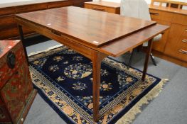 A stylish Scandinavian rosewood rectangular extending dining table.