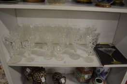 A quantity of John Walsh glassware together with an associated book.