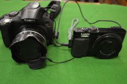 Two digital cameras.
