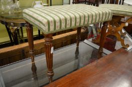 A 19th century mahogany rectangular stool with turned and reeded legs.
