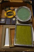 Two silver photograph frames and other frames.