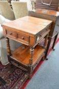 A mahogany two tier work table with folding top together with an early mahogany filing unit.