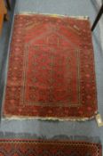 A small Persian prayer rug 106cm x 78cm.