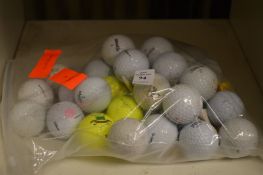 A bag of assorted golf balls.