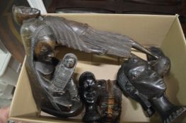 A carved African items and a foot massager.