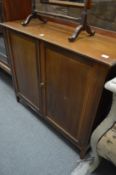 An Edwardian mahogany two door cupboard.