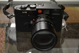 A Leica M6 camera and lens.