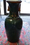 A large Chinese style green glazed pottery vase.