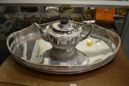 A plated twin handled gallery tray and a plated tea pot.