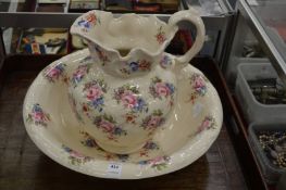 A floral decorated jug and bowl set.