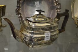 A silver teapot.