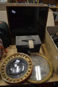 A small gilt framed convex mirror, circular gilt framed engraving, an old leather box and a