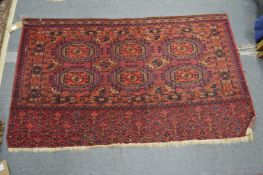 A Persian Tekke Bokhara wall hanging or rug 137cm x 83cm.