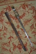 An early 19th century sword and scabbard, possibly made for theatrical use.