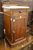 A Victorian mahogany pot cupboard with marble top.