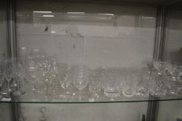 A shelf of drinking glasses.
