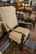 A 17th century style walnut framed open armchair.