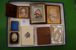 Travelling photograph frames, miniature photographs, card cases etc.