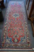 A Persian design runner or hall carpet, red ground with floral decoration 280cm x 100cm.