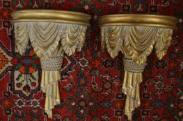 A pair of decorative wall brackets.