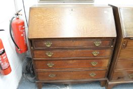 A George III oak bureau.